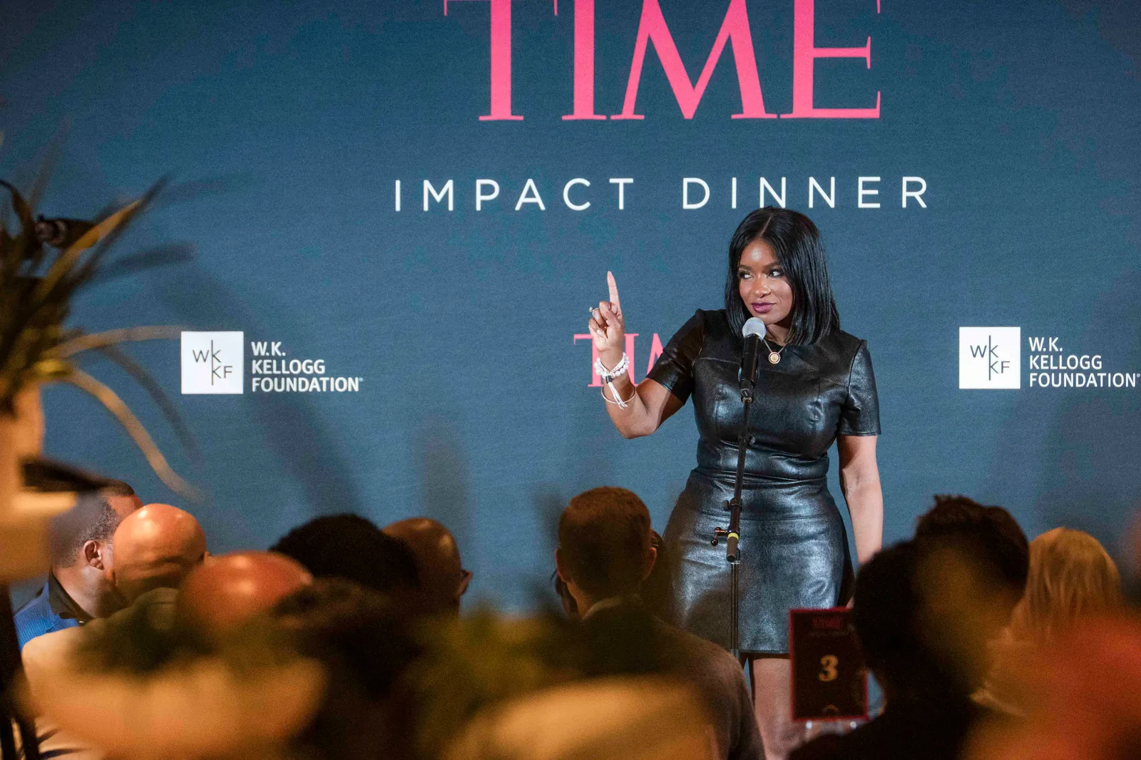 At the podium, TIME Impact Dinner